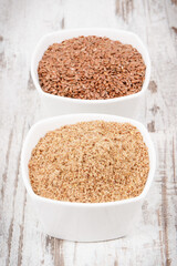 Linseed in glass bowls. Healthy food containing vitamins, fiber and acids omega