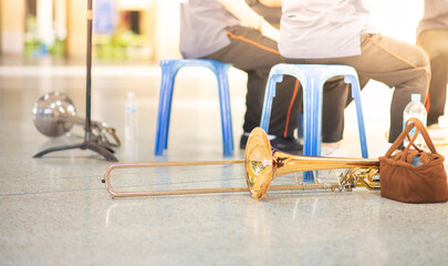 Fototapeta na wymiar Trombone on the floor practicing time in the music class