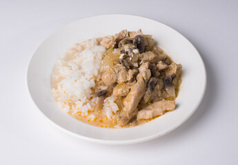 Beef stroganoff with rice on a plate. Tasty healthy food