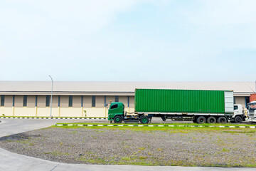 Trucks parked in front of the warehouse building