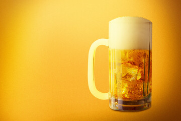 The glass of cold beer with a yellow background