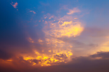 Dramatic atmosphere panorama view of natural sunlight effect on blurry soft clouds with twilight golden sunset sky for silhouette background.