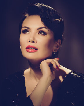 Closeup portrait of attractive hollywood styled elegant woman. retro style toned image