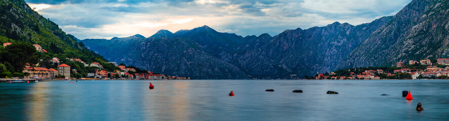 Panoramic view of Kotor Bay or Boka Kotorska with mountains, crystal clear water at sunset in the Balkans, Montenegro on the Adriatic Sea