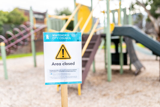 Playground In The Park, With A Closed Restriction Sign Due To Pandemic