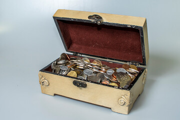 small carved box with old coins