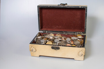small carved box with old coins