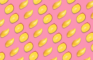 Pattern of whole and cut mango fruits on pink background