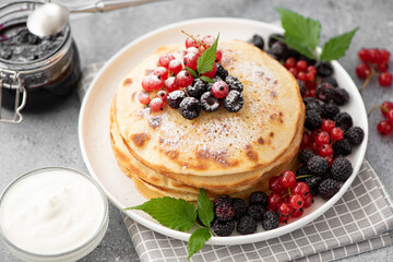 homemade pancakes with fresh berries and jam