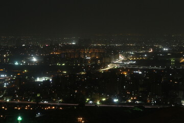 Fototapeta na wymiar Cityscape night over mount at Mukattam in Egypt 