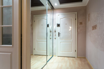 doors in modern entrance hall of corridor in expensive apartments