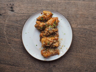 Top view fried chicken wings with Korean garlic sauce style