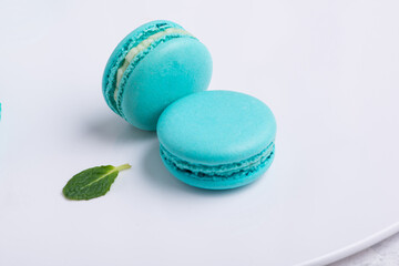 blue Macaroni cookie French on white plate. Studio photo