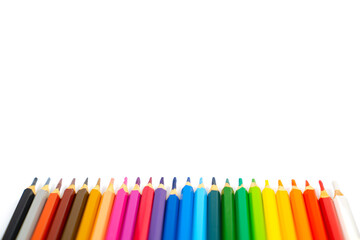 blunt colour pencils are arranged in the line on the white background and ready to paint.
