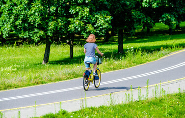 Cyclist ride on the bike path in the city Park
