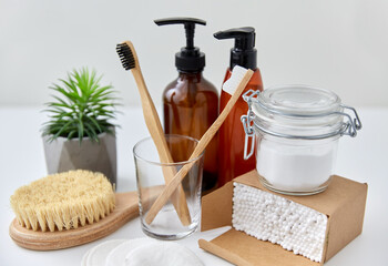 natural cosmetics, beauty and eco living concept - wooden toothbrushes, cotton swabs in paper box...