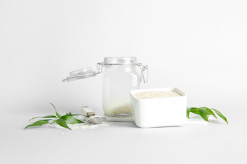 Jar of rice water on white background