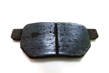 Worn out brake pad or brake shoes, component showing steel backing plates with friction material...