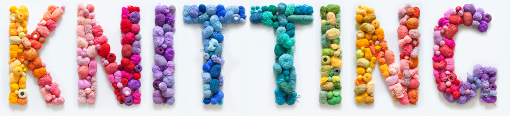 The word Kniting is made up of multi-colored skeins and a ball of yarn. White background. Rainbow color gradient.