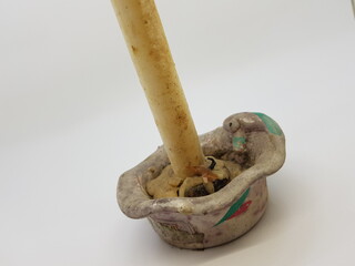 Candle in a candlestick, vintage candle holder on a white background