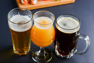 Assortment of beer glasses isolated on black background. Top view. Different kinds of beer