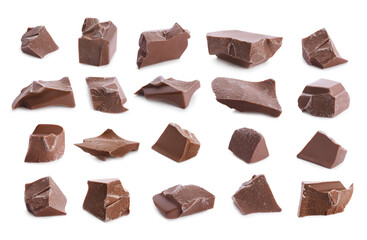 Set with pieces of delicious milk chocolate on white background
