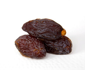 Royal large dates Medjool on a white background