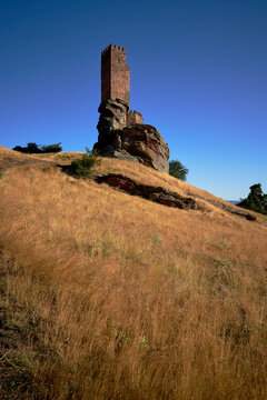 beautiful view of the tower and rock of the castle of zafra in vertical distance in the province of guadalajara in spain