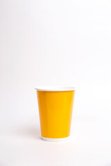 yellow paper cup isolated on white background