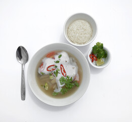Tom kha soup with pepper, tomatoes, mushrooms, onions, coconut milk and noodles