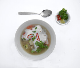 Tom kha soup with pepper, tomatoes, mushrooms, onions, coconut milk and noodles