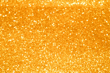 gold Sparkling Lights Festive background with texture. Abstract Christmas twinkled bright bokeh defocused and Falling stars. Winter Card or invitation	