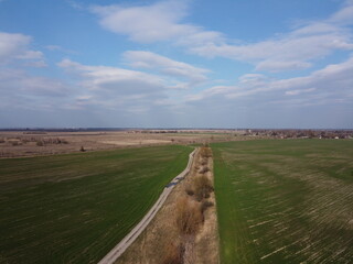 Abandoned land reclamation canal in the field, aerial view. Agricultural landscape.