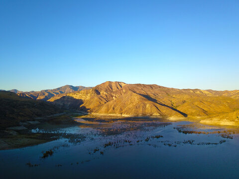 A Majestic Aerial View Of The Still Blue Waters Of Lake Piru In California