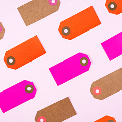 Blank label tag isolated on pink background. Price tag. Sale concept.