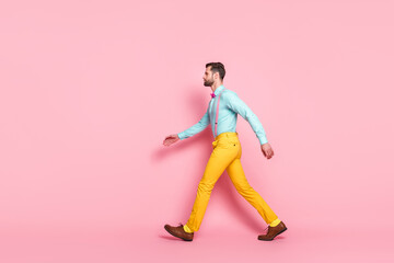 Fototapeta na wymiar Full size profile side photo of masculine macho man go walk copyspace spring travel trip wear good look clothes isolated over pastel color background