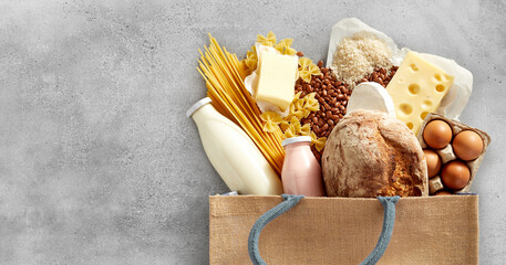Shopping bag filled with dairy and carbohydrates