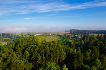 Fototapeta na wymiar Landscape view of the village in the fog