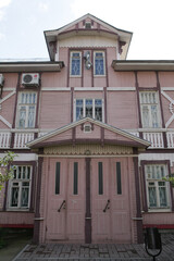 Vintage wooden house with carved windows on Pushkin Street, 13, Yaroslavl city, Russia. Russian...