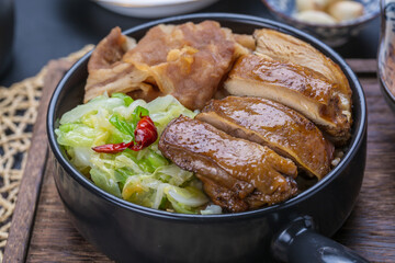 Chicken steak, beef and kohlrabi rice bowl on wooden table
