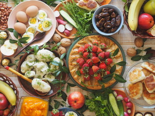 Soft focus or blurry focus.Photo above.A lot of wholesome vegetarian food on the table, ready to receive guests. Healthy homemade food.