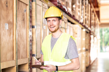 Portrait white caucasian worker with tablet in distribution warehouse