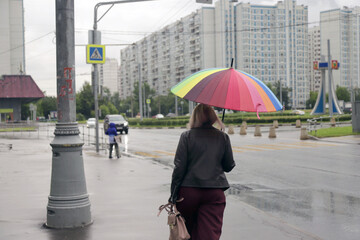 woman walking in the rain