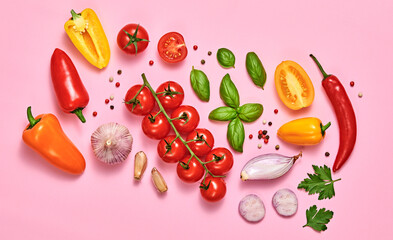 Tomato, basil, spices, bell chili pepper, garlic. Vegan diet food, creative composition on pink. Fresh basil, cherry tomatoes, bell pepper layout, cooking colorful concept, top view.