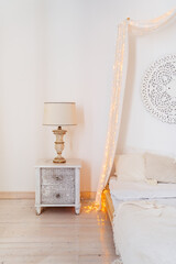 elements of interior. vintage bedside table with table lamp. 
