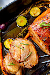 Lecere roll roast with vegetables and herbs.