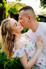 beautiful and happy couple having fun in garden.