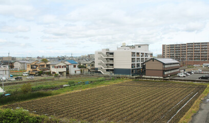 View of a rural town with the paddy fields along the way to Nara, Japan