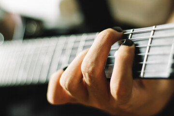 Close-up of Hand playing the guitar