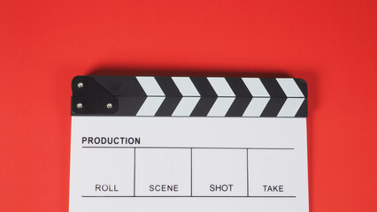 Obraz premium Clapperboard or movie slate. it use in video production ,film, cinema industry on red background.